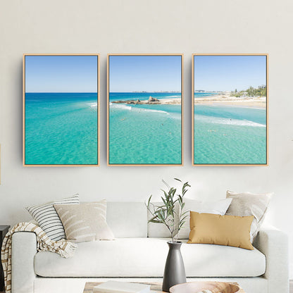 Palm Beach Surfers three piece canvas wall art III in living room