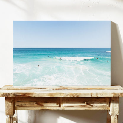 Stretched canvas print of aerial photography of Scarborough Beach, surfers waiting beside a small breaking wave in turquoise water on a console table