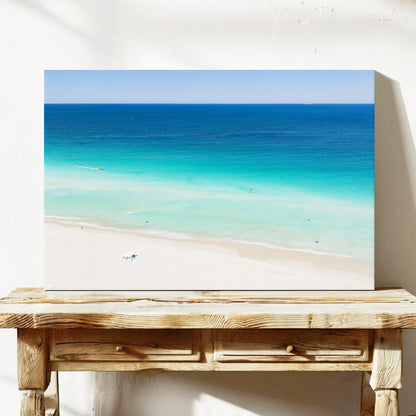 Stretched canvas print of aerial photography of Scarborough Beach, deep blue water, turquoise shallows and an almost empty white sand beach on a console table