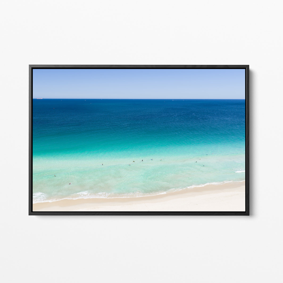 Black framed canvas print of aerial photography of Scarborough Beach, dark blue ocean, a turquoise band of shallows and pale sand