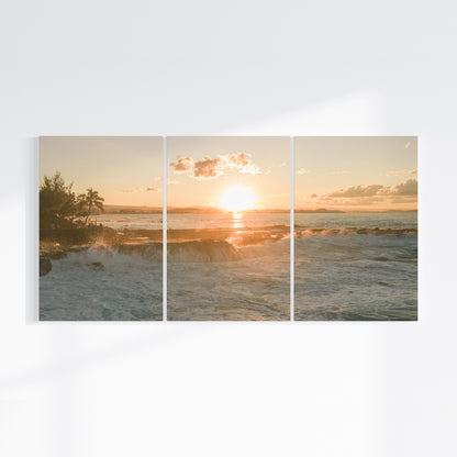 Snapper Rocks sunset three piece canvas wall art on wall