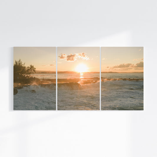 Snapper Rocks sunset three piece canvas wall art on wall