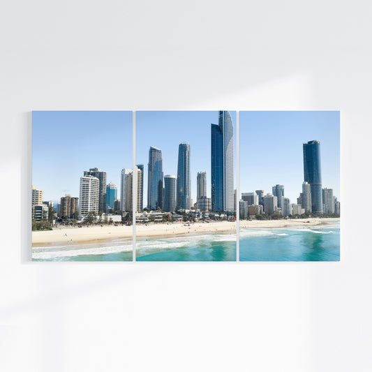 Surfers Paradise three piece canvas wall art on wall